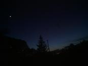 There was a cool subset and moon over the city today, but I was a little late snapping the picture.