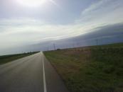 The state road cut through a large wind farm.