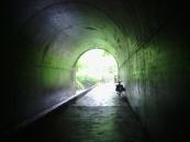 A view from inside. The trail is on the right, and a river is on the left.