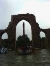 Historical iron post in front of ruins left from mughal era