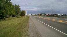 A small aircraft taxiing across a street at the Anchorage airport as I walked up to Everts