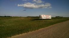 Entering USA shortly. I would have stopped for a picture of the real sign but I was pretty worried about my bike at the time.