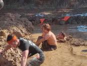 He is up to his neck in muddy water